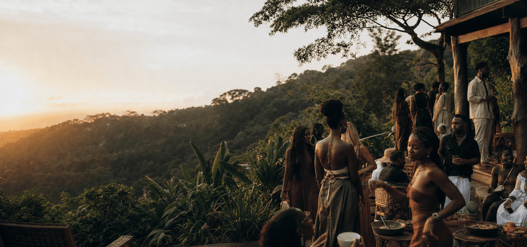 Friends gather on a lush hillside in Aburi at sunset
